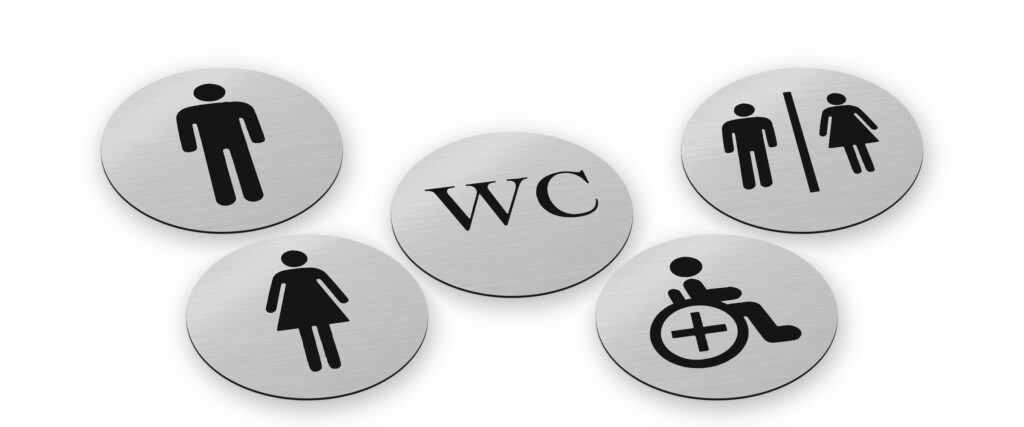 WC Schild in fünf Ausführungen, rund in gebürsteter Silber-Optik mit schwarzer Gravur: Schild „WC“ in der Mitte, daneben Herren, Damen, Herren-und-Damen-Symbol und Rollstuhl-Symbol